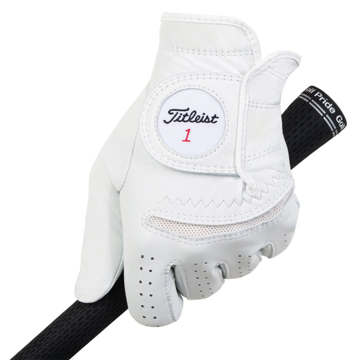 Titleist Perma-Soft golf glove in Pearl worn on the left hand, back view, gripping a black club grip