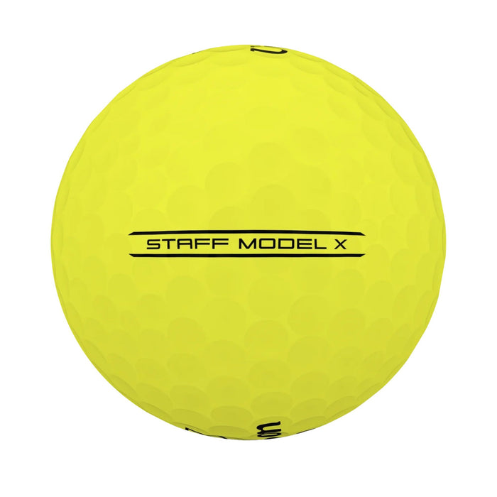 Side view of a yellow Wilson Staff Model X ball showing the STAFF MODEL X sidestamp between two lines